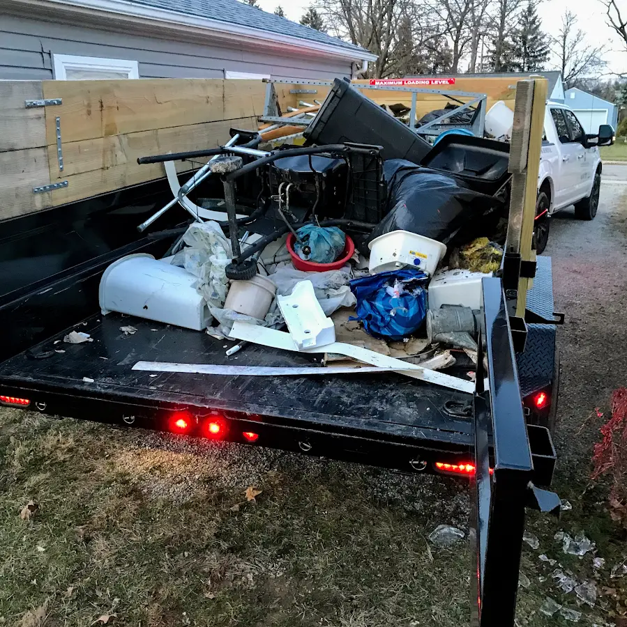 Roll-off dumpster delivered to a residential driveway in Kingsland